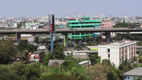 elevated train moving through bangkok cityscape