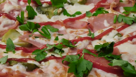 close-up of a delicious ham and pickle pizza