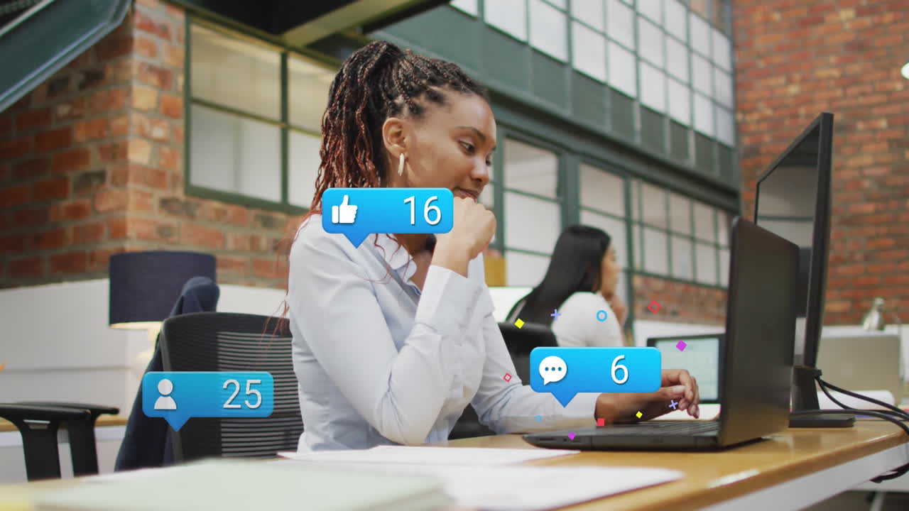 Animation of social media icons and data over african american businesswoman in office
