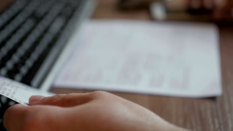 a man scans the qr code on a check from a supermarket.