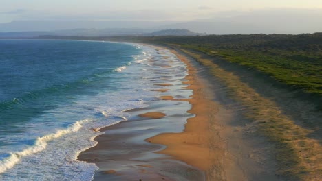 Aerial-view-of-Scenic-Wild-Natural-Port-Kembla-Beach-at-Wollongong,-NSW-Australia---Tilt-up-shot