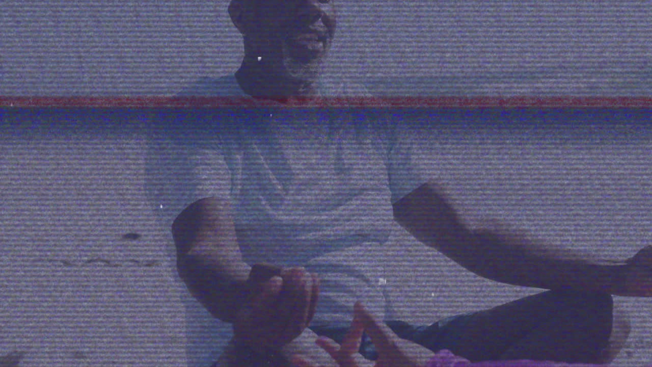 Meditating outdoors, man surrounded by animation with static overlay effect