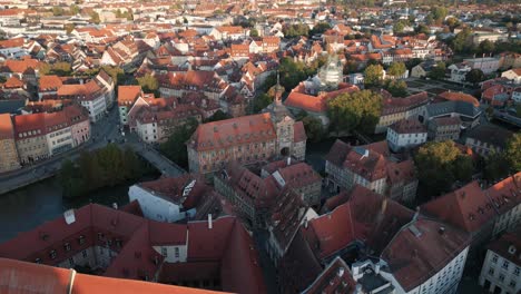 drone reveal of the old townhall in bamberg with cityscape and regnitz river in the background