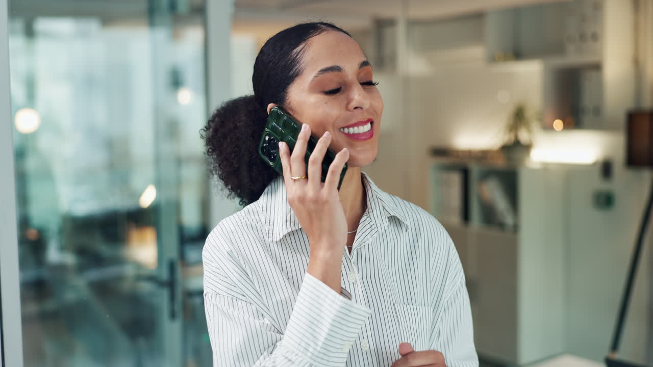 Professional woman on a business call in a modern office