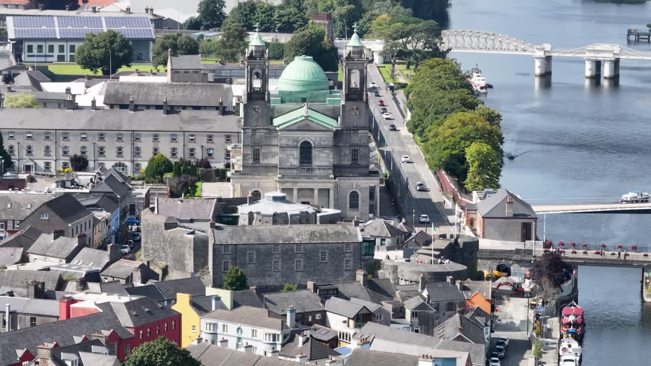 Aerial close up of Athlone Cathedral and Castle buildings, riverside small town, Ireland