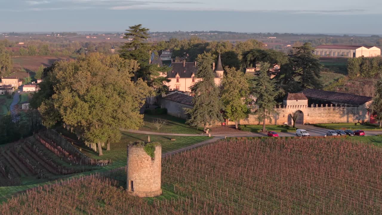 Aerial view of beautiful sunrise over historical Pressac castle in Saint-Emilion Vineyard area