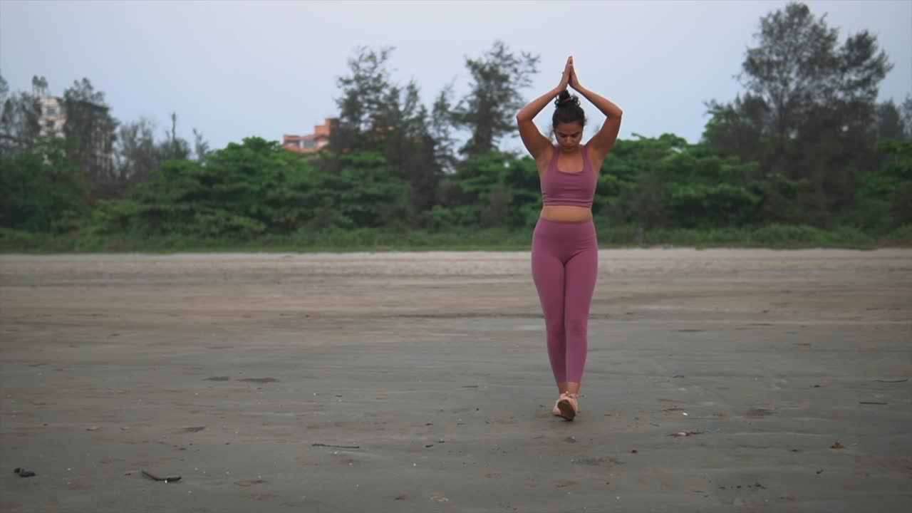 Indian Outdoor Gym Girl, Warms Up With Beach Praying Hands Exercise Routine