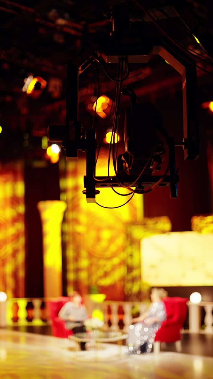Professional camera filming with on the backstage of a TV set