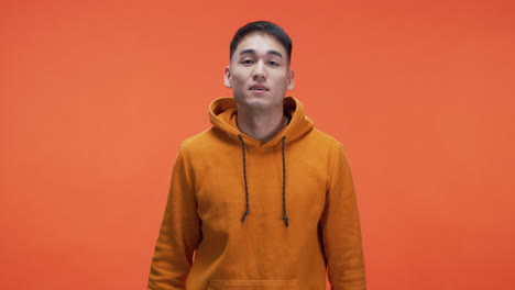 man in orange hoodie