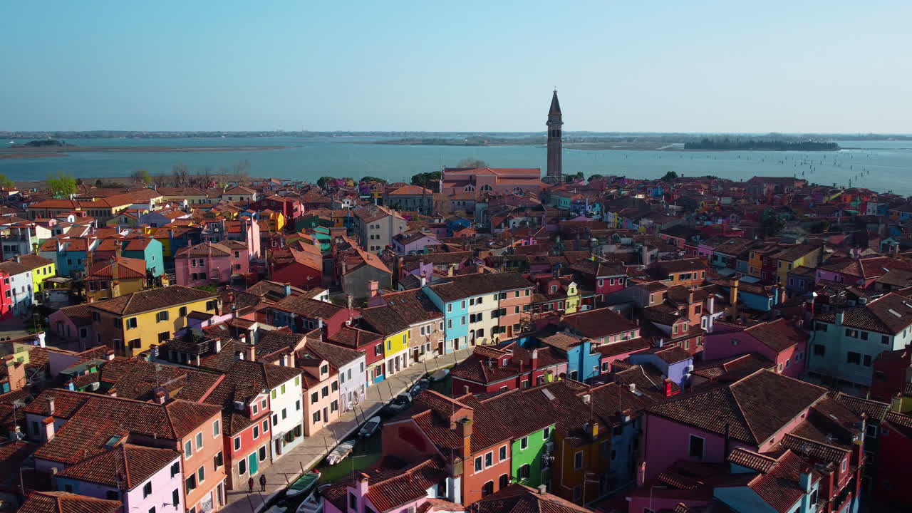 Aerial drone view of Burano island near Venice. Colorful and colorful houses in the middle of the Venetian lagoon. Burano bell tower