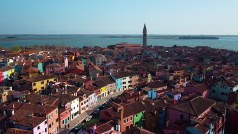 aerial drone view of burano island near venice. colorful and colorful houses in the middle of the venetian lagoon. burano bell tower