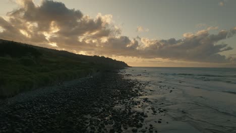 Coastal-landscape-at-Omaui-beach-in-New-Zealand-during-sunset,-aerial