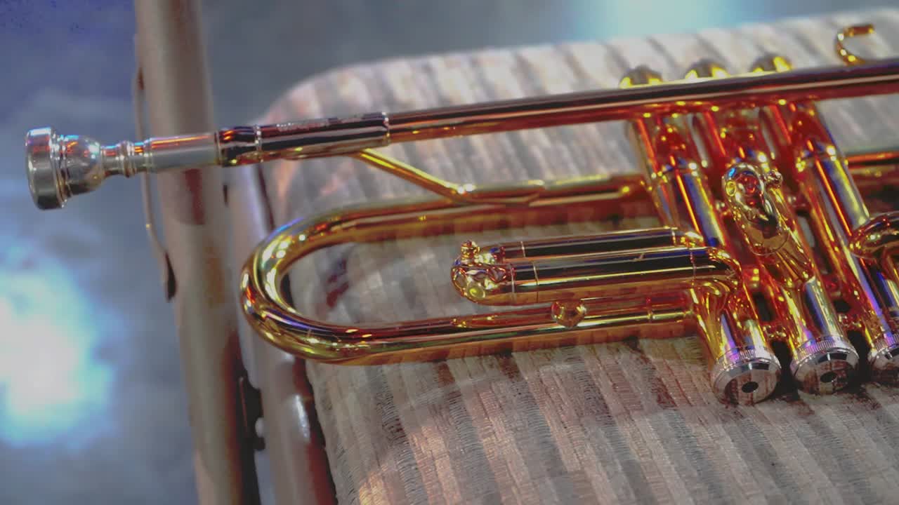 Trumpet on a musical chair ready to be played for a concert.