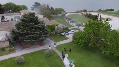 Wedding-Couple's-Arrival-at-Waterfront-Reception-Venue-with-smoke-blu