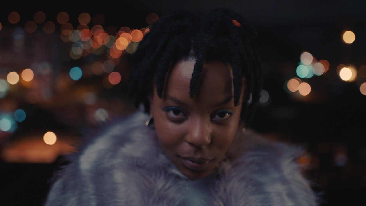 portrait beautiful african american woman blowing kiss enjoying urban nightlife wearing stylish fashion looking confident black female in city at night