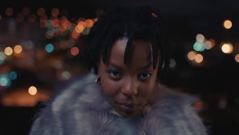 portrait beautiful african american woman blowing kiss enjoying urban nightlife wearing stylish fashion looking confident black female in city at night