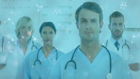 animación de redes de conexiones que se mueven sobre el retrato del equipo de un médico masculino y femenino