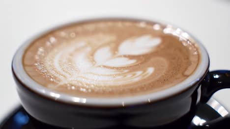 a warm and inviting cup of coffee with beautiful latte art showcasing intricate designs and rich, creamy textures for the perfect coffee experience