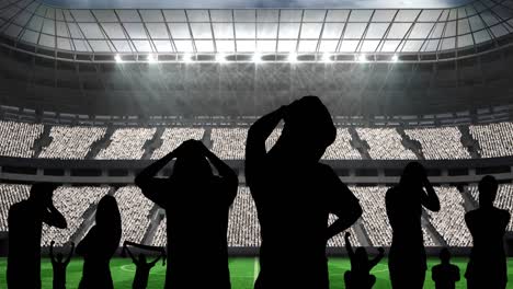 Animation-of-silhouettes-of-disappointed-sports-fans-over-sports-stadium