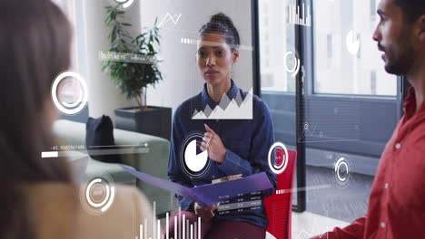 discussing data analytics, businesswoman with colleagues and digital graphs in office