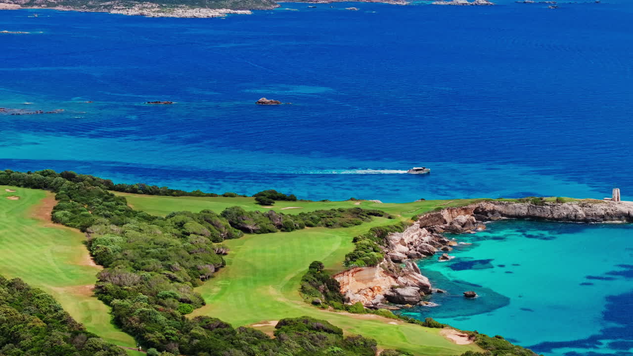 Aerial drone view of beautiful coastline of Corsica, France. High view of the colorful turquoise sea and the picturesque green landscape. Bird's eye view of the beaches. Summer holidays destination