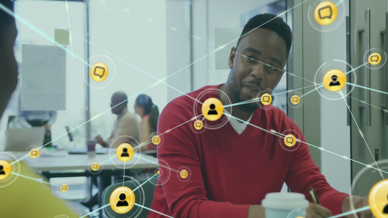 Animation of network of connections with icons over afrcian american business people