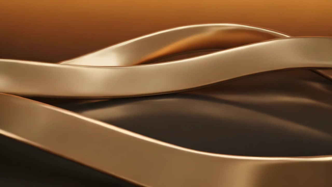 Panning camera revealing polished gold bands looping on black base to showcase amber highlights