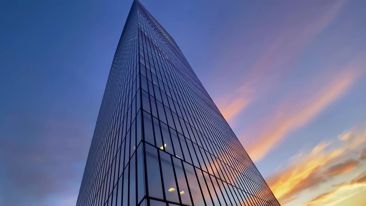 Arranha-céu Moderno de Vidro Refletindo o Céu do Pôr do Sol