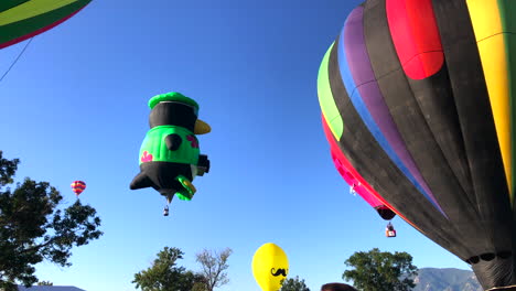 Penguin-and-other-balloons-lifting-off