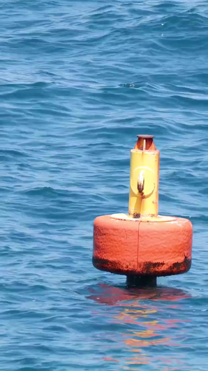 A buoy floating in the ocean waves