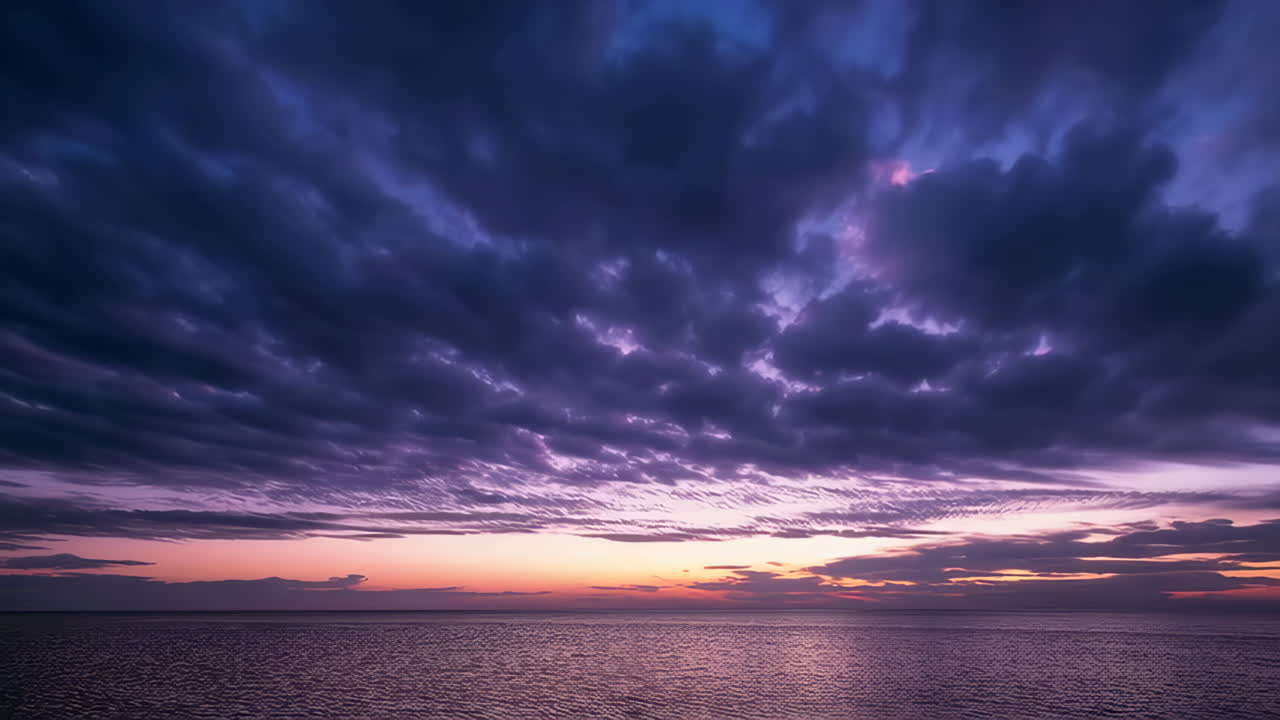 Vibrant Twilight Over the Ocean with Dramatic Clouds