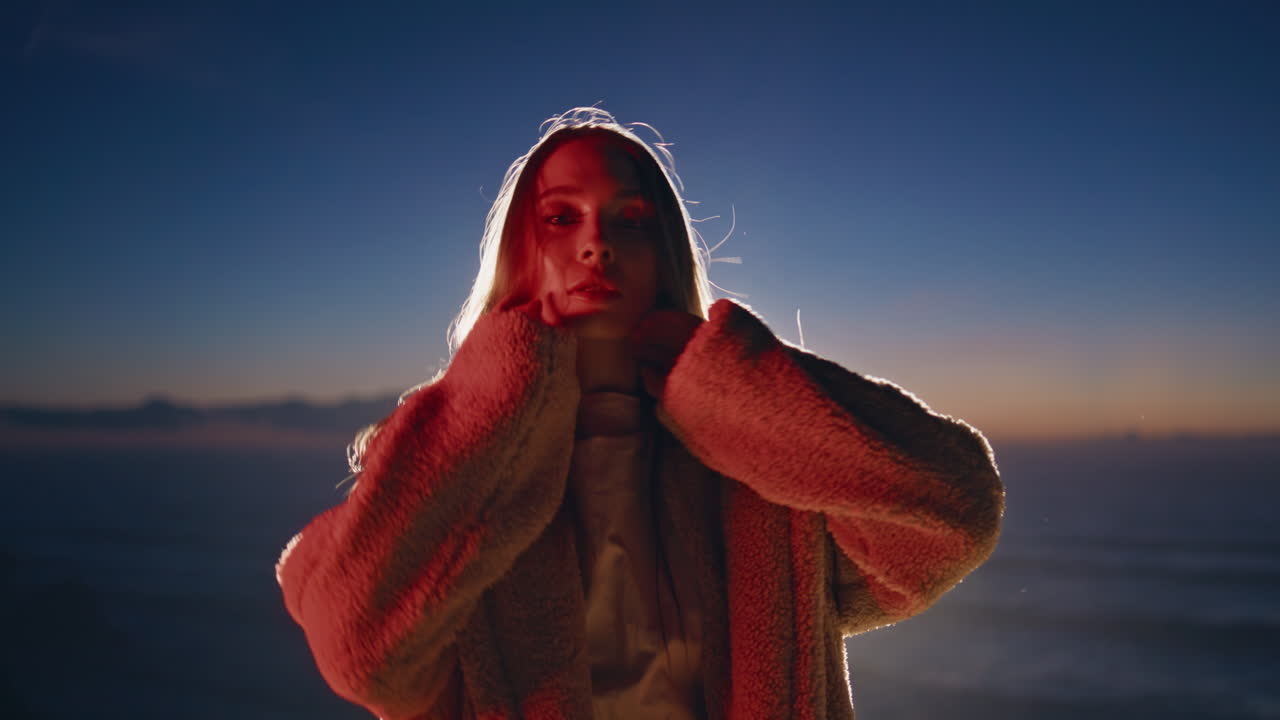 Sexy dancer performing contemporary style at evening closeup. Neon woman dancing