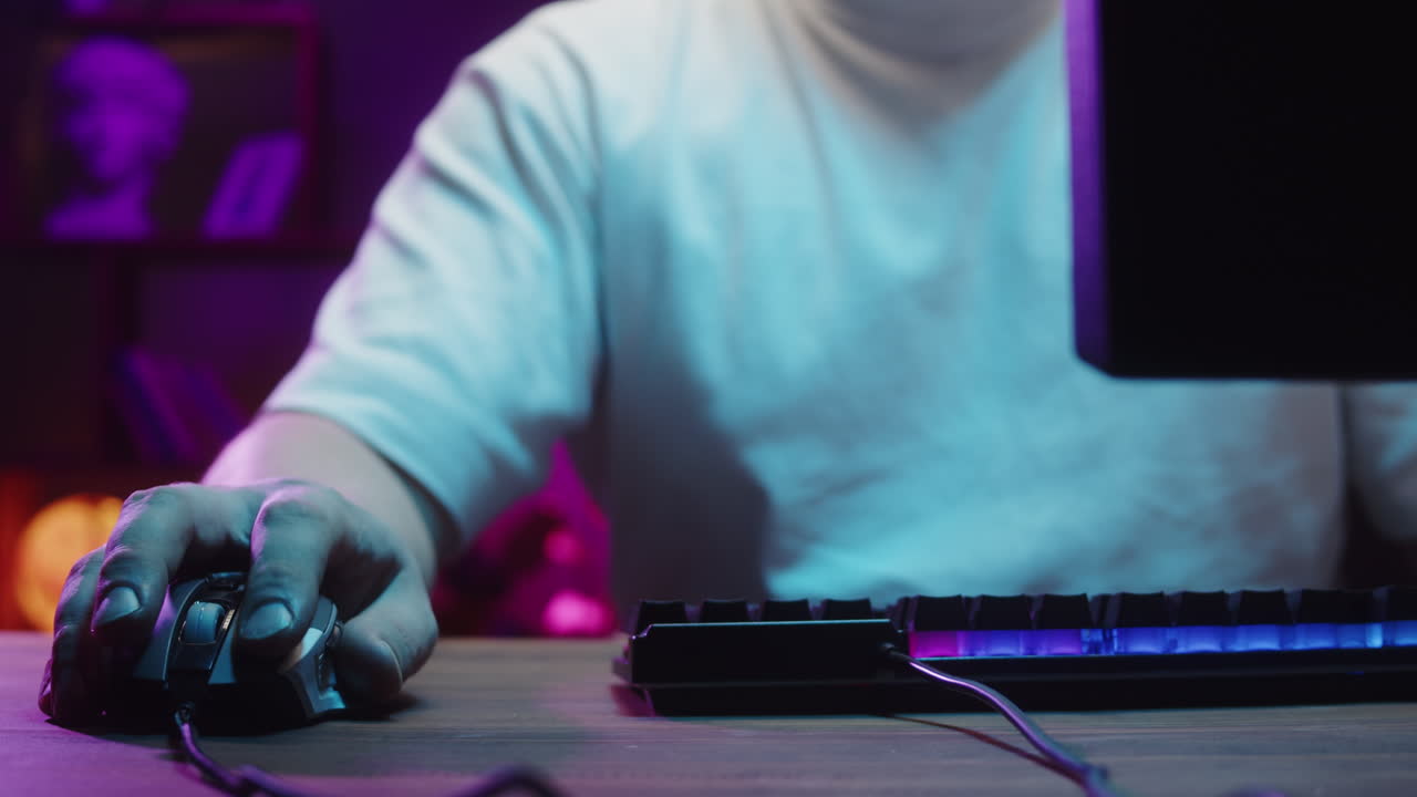 Close-up of Gamer's Hand Using Computer Mouse