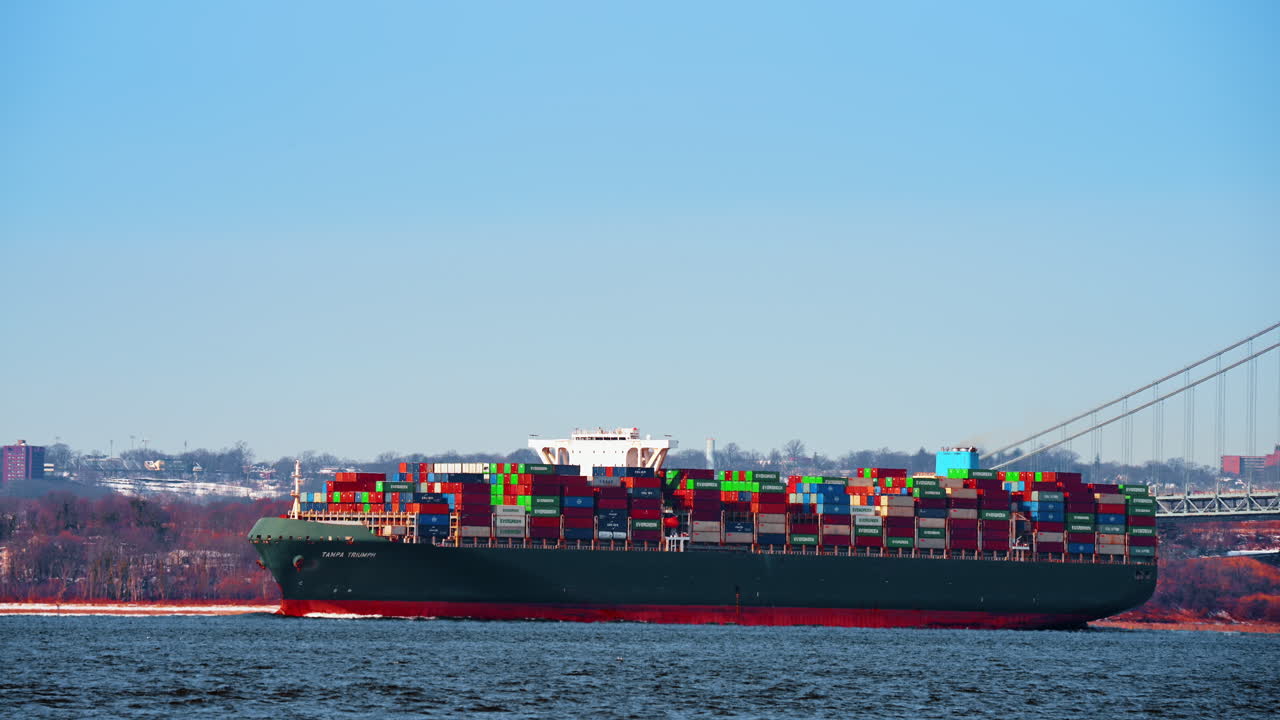 New York, USA, 25 December 2025: Container ship in New York Harbor. Large cargo ship loaded with containers sails through New York Harbor