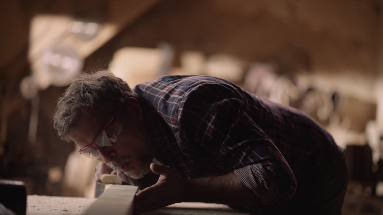 Carpenter sanding wood