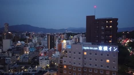 evening timelapse of hiroshima city, viewed from a high building at the peace boulevard.