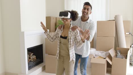 Happy-young-couple-doing-Virtual-tour-in-new-apartment