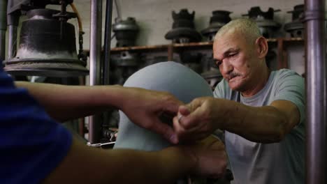 Mixed-race-man-working-at-a-hat-factory