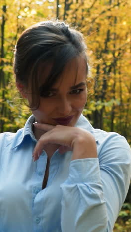 woman posing in park. happy young woman posing in autumn park