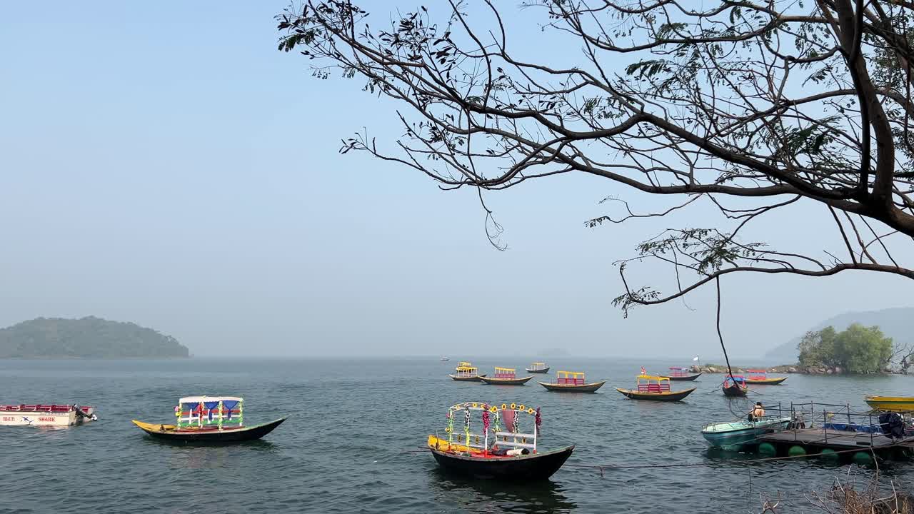 Shikara boats halted at shore of sea and shaking due to heavy ripples on sea in Maithon dam.
