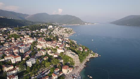 aerial: herceg novi, montenegro with coastal landscape and mountains