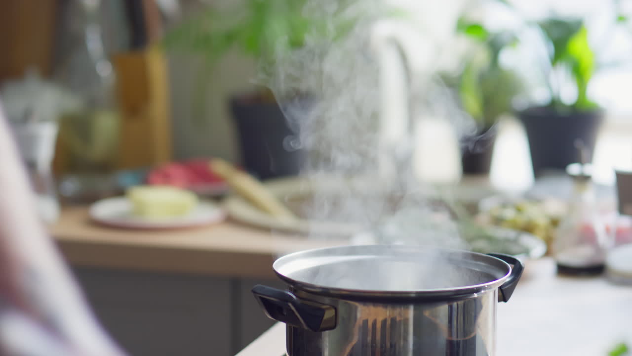 Putting Potato in Pot with Boiling Water