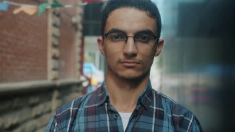 young man in a city alley