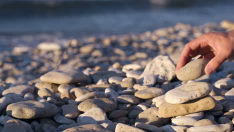 Hand-making-stone-pyramid