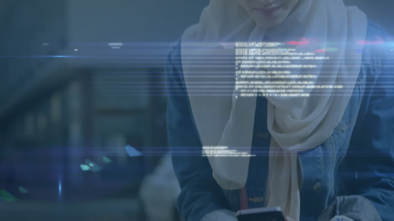Young woman in hijab using smartphone with digital code overlay animation