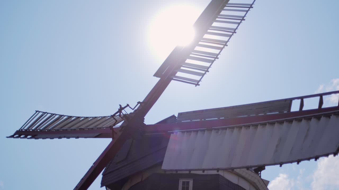 Close-up of a Windmill with Sun in the Background