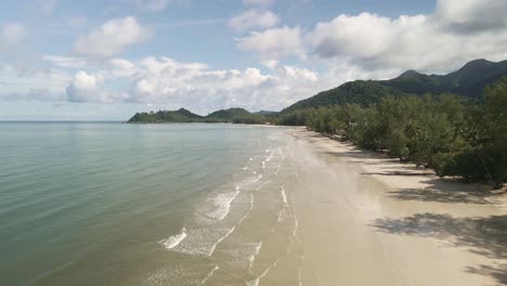 low angle aerial drone view of tropical beach on koh chang island in thailand