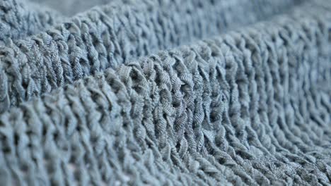 shallow dof knitting made sweater texture details slow tilt 4k 2160p 30fps ultrahd  footage - close-up of fine green knitwork fine texture  3840x2160 uhd tilting video