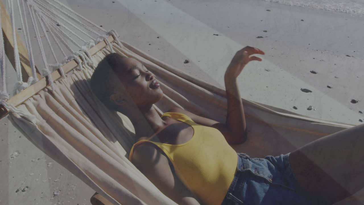 woman reclining canvas hammock on sandy beach, showing travel marketing with animated chart overlay