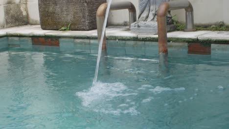 footage of a pool fountain sculpture in bali
